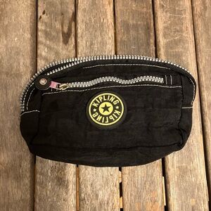 Kipling Black Pouch with Circular Yellow Emblem